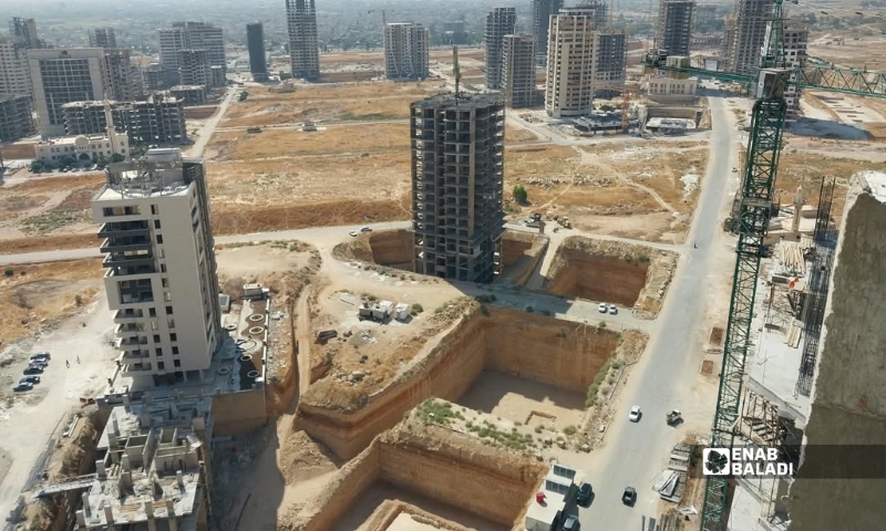 The Marota City project introduces isolated glass buildings and towers that disrupt Damascus's traditional skyline and create a stark contrast with neighboring residential areas, April 6, 2026 (Enab Baladi).