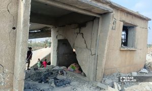 Children play atop a building destroyed by a Jordanian airstrike in Muzayrib (western Daraa countryside, southern Syria), October 27, 2026 (Enab Baladi/Mahjoub al-Hashish)