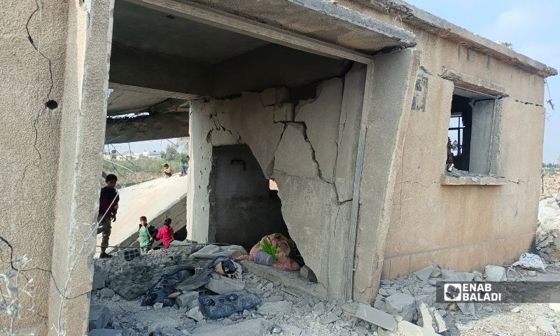 Children play atop a building destroyed by a Jordanian airstrike in Muzayrib (western Daraa countryside, southern Syria), October 27, 2026 (Enab Baladi/Mahjoub al-Hashish)
