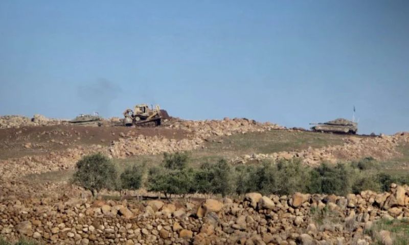 A bulldozer accompanied by two Israeli tanks levels agricultural land in the Quneitra countryside, January 16, 2026 (SANA)